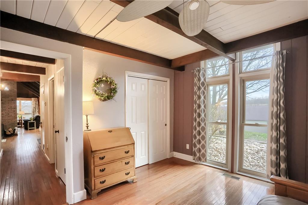 544 Valencia Road Mars, PA 16046 - Photo 19 of 25 a view of a hallway with a window and wooden floor