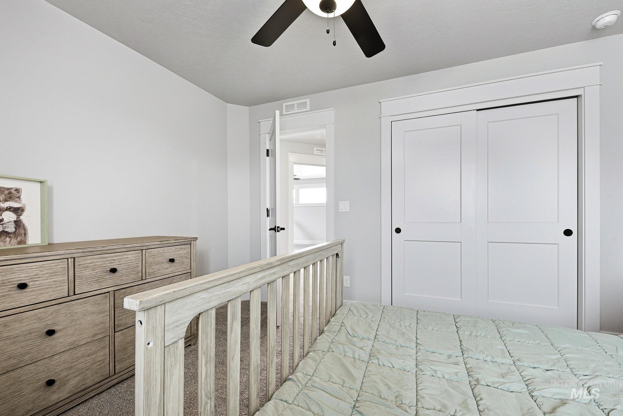 5676 East Zaffre Ridge Street Boise, ID 83716 - Photo 38 of 50 Bedroom featuring clean white walls and carpeting