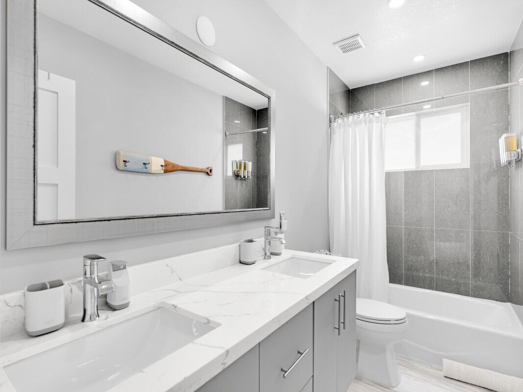 325 Calusa Street, Unit 359 Key Largo, FL 33037 - Photo 19 of 52 a bathroom with a granite countertop sink toilet and shower