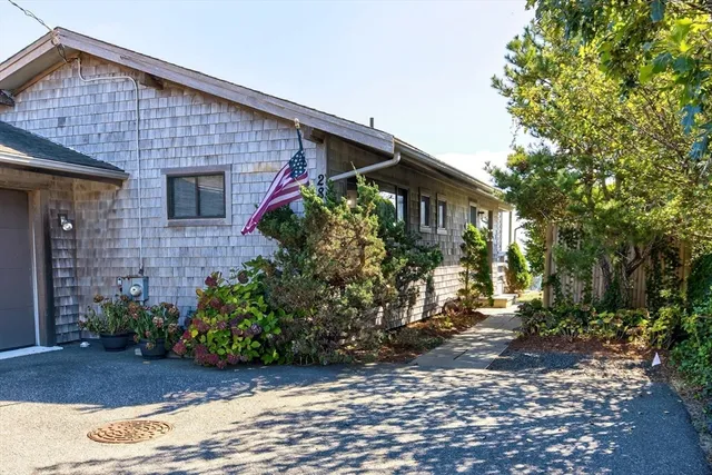 a front view of a house with garden