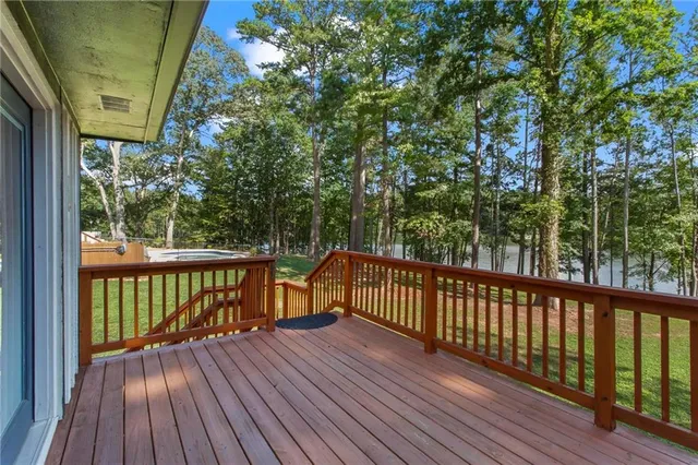 a view of a house with swimming pool and a yard