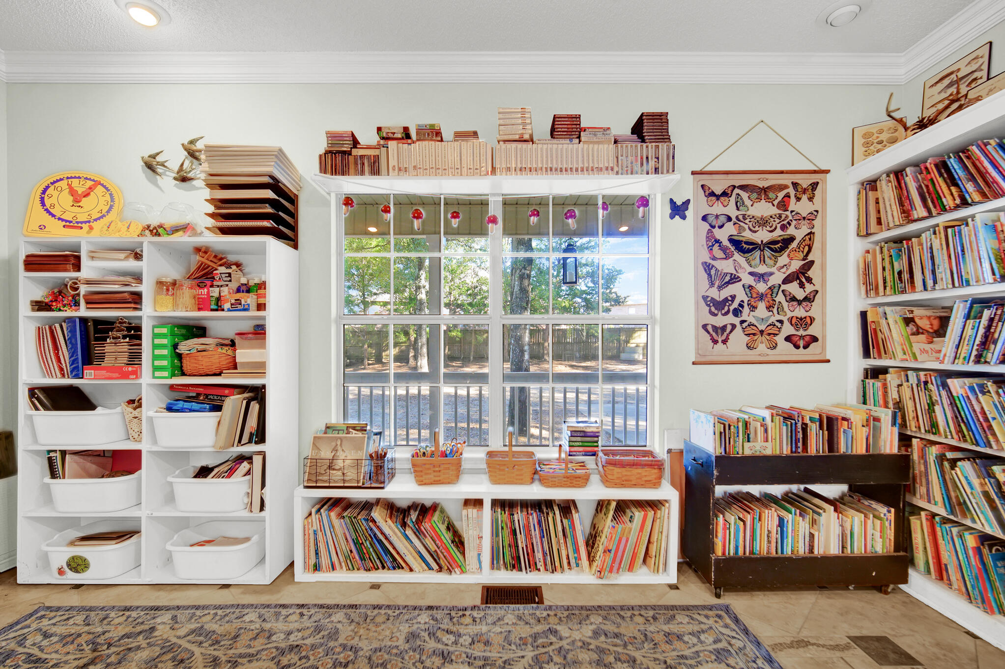 115 Steves Place Crestview, FL 32536 - Photo 12 of 66 a bedroom with furniture and a book shelf