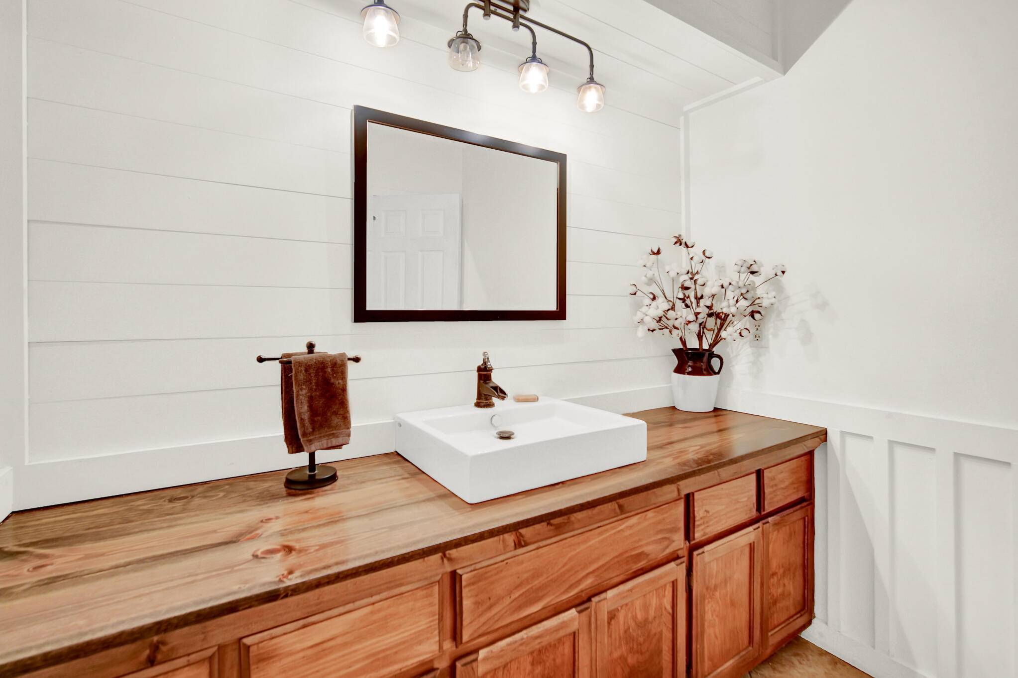 115 Steves Place Crestview, FL 32536 - Photo 37 of 66 a bathroom with a sink and a mirror