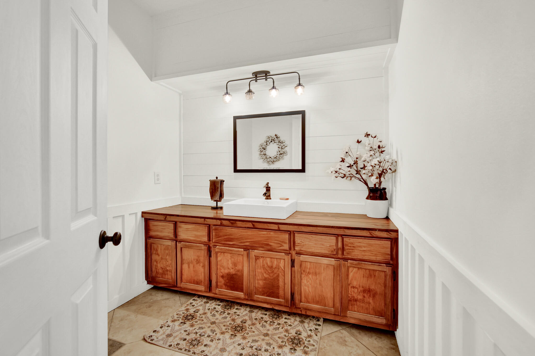 115 Steves Place Crestview, FL 32536 - Photo 38 of 66 a bathroom with a sink and a mirror
