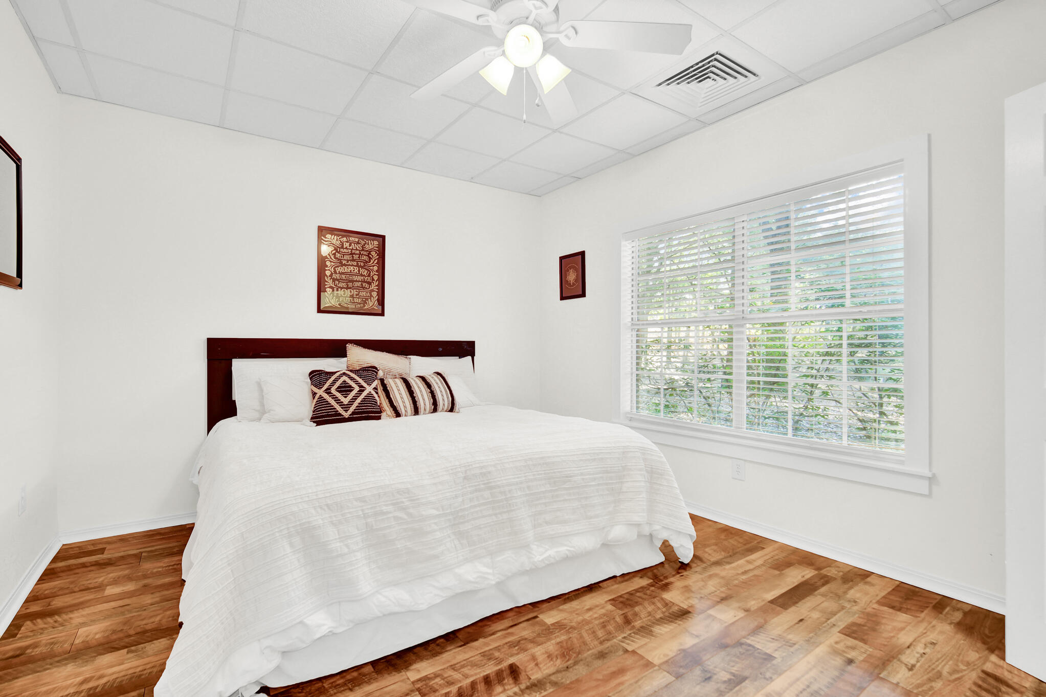 115 Steves Place Crestview, FL 32536 - Photo 50 of 66 a bedroom with a large bed and a window