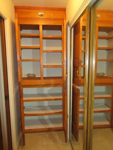 a view of a livingroom with a chandelier fan