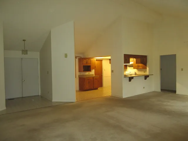a view of a livingroom with a kitchen