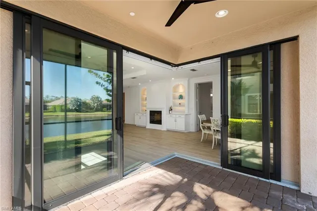 a kitchen with stainless steel appliances granite countertop white cabinets and a stove top oven