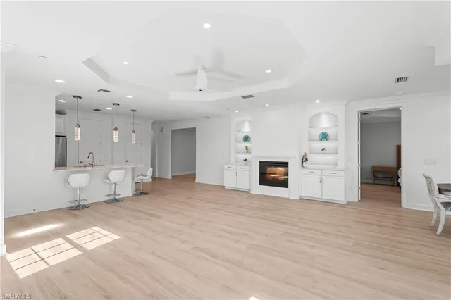 a view of a kitchen with furniture and a fireplace