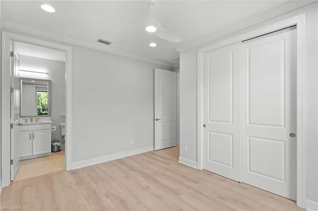 a bathroom with a granite countertop sink a mirror and shower
