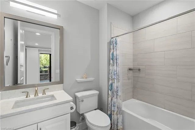 a view of a balcony with wooden fence