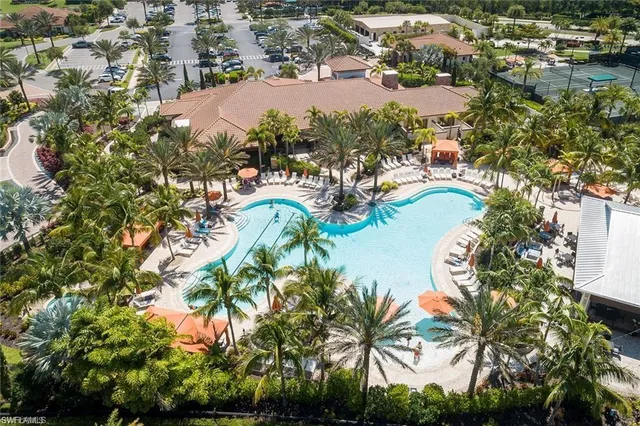 a view of a swimming pool with an outdoor seating