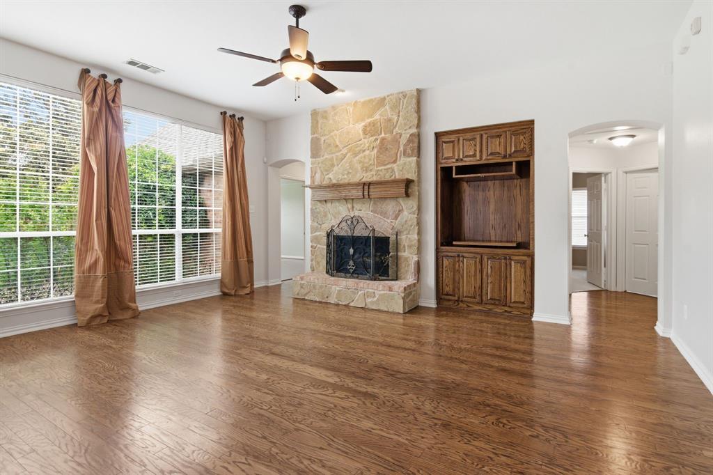 8180 Holliday Road Lantana, TX 76226 - Photo 9 of 31 Gather around this stunning stone, gas fireplace.