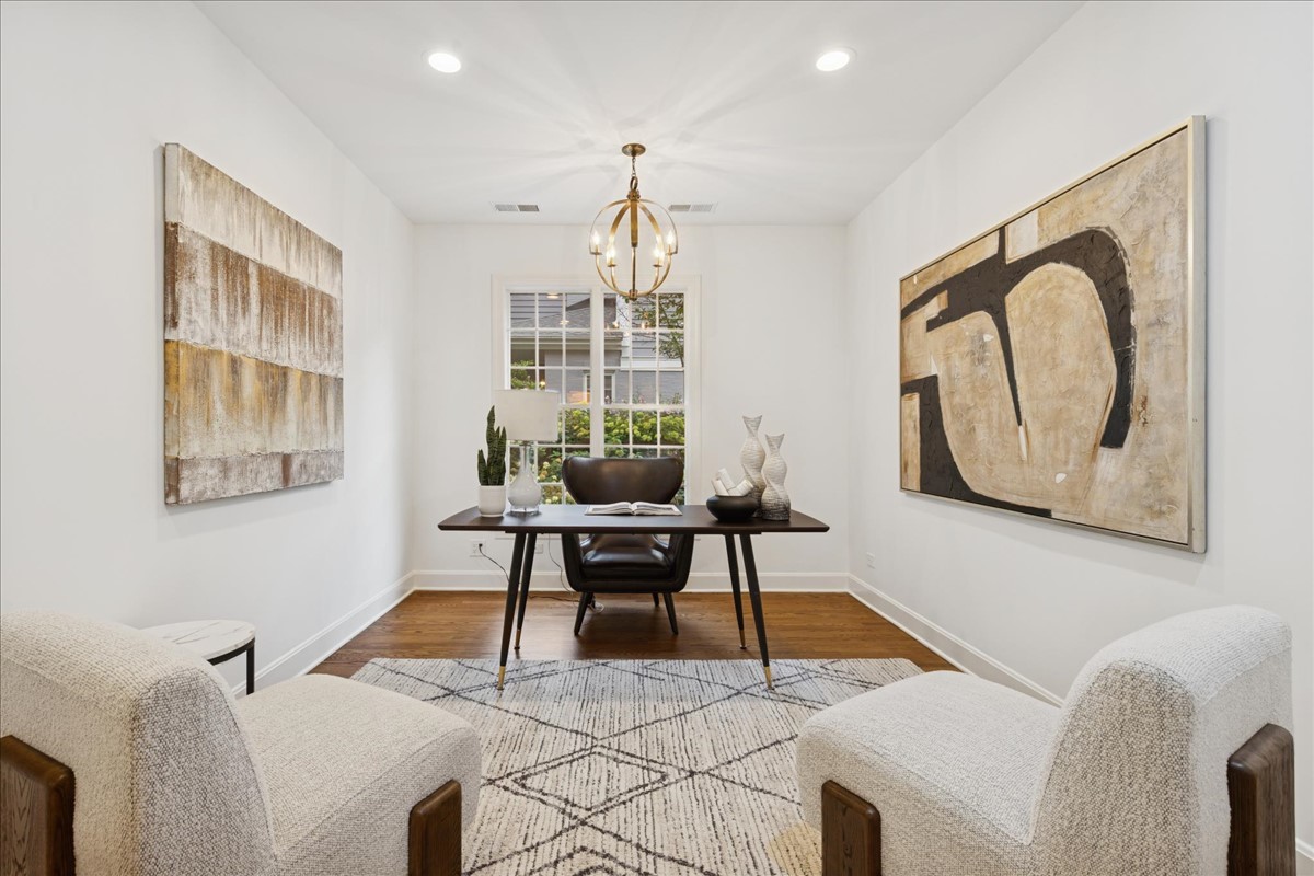 628 South County Line Road Hinsdale, IL 60521 - Photo 15 of 34 a living room with furniture a window and a chandelier