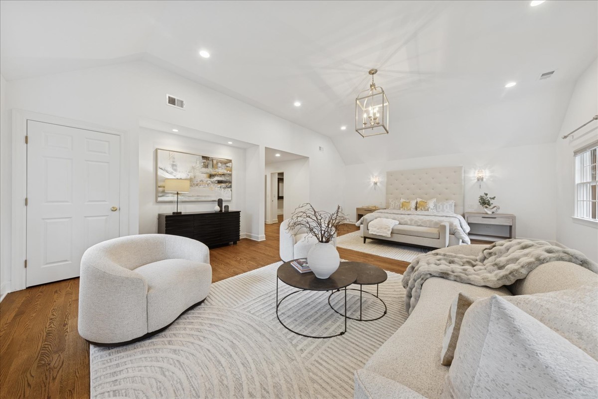 628 South County Line Road Hinsdale, IL 60521 - Photo 18 of 34 a living room with furniture and a chandelier