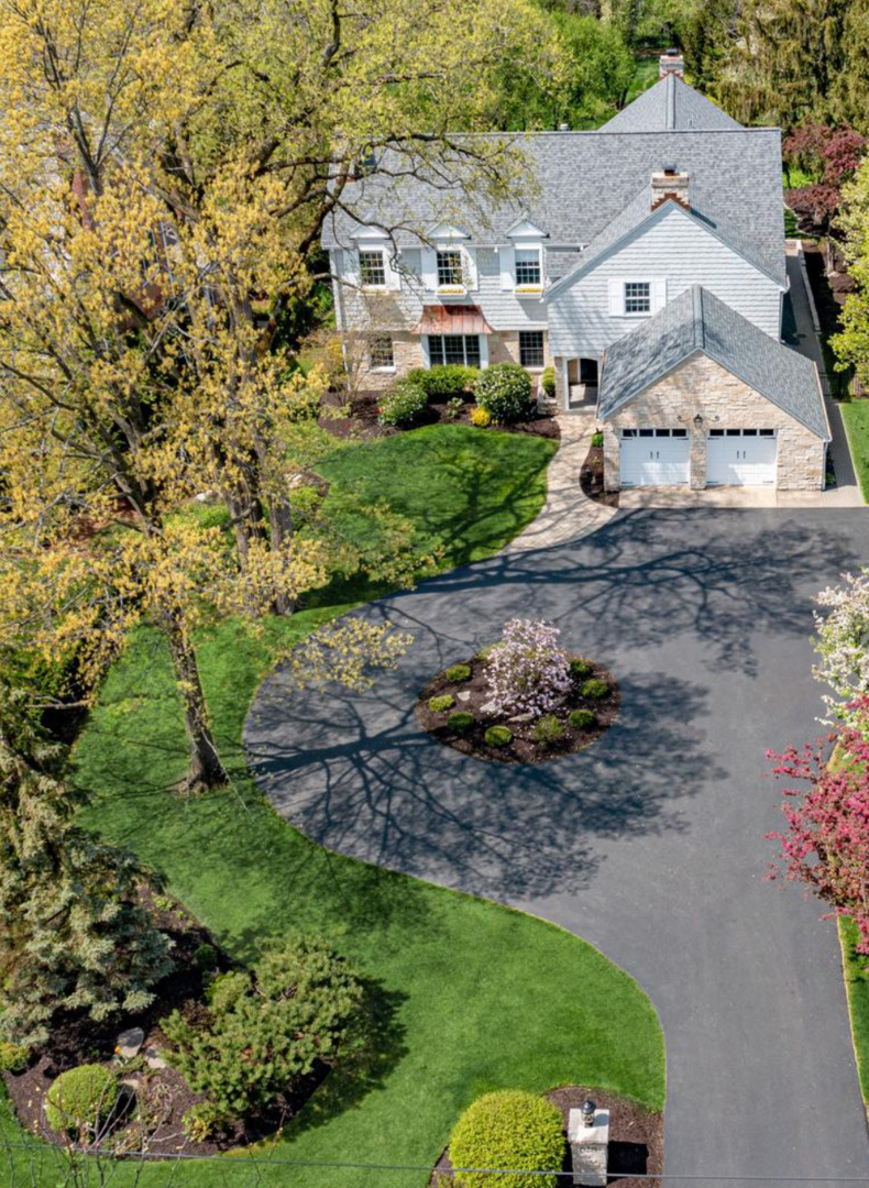 628 South County Line Road Hinsdale, IL 60521 - Photo 2 of 34 a aerial view of white house with a yard