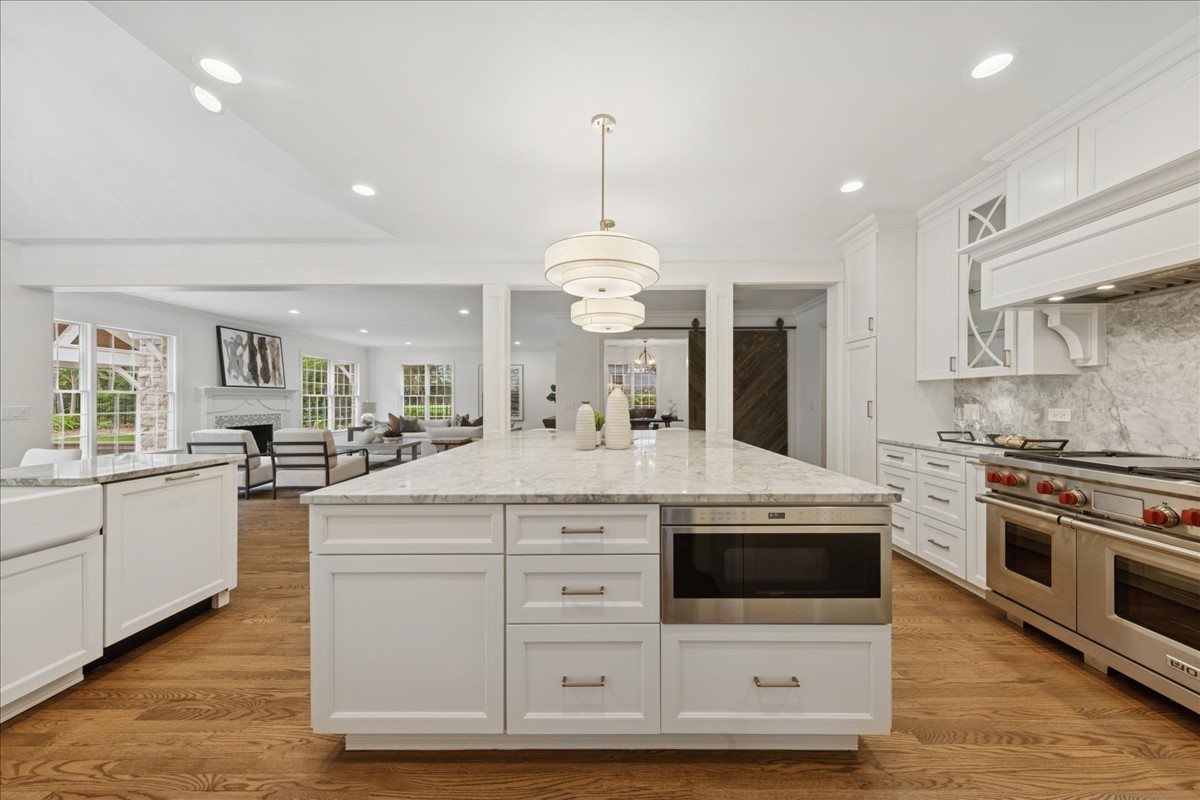 628 South County Line Road Hinsdale, IL 60521 - Photo 10 of 34 a kitchen with stainless steel appliances granite countertop a stove and a sink