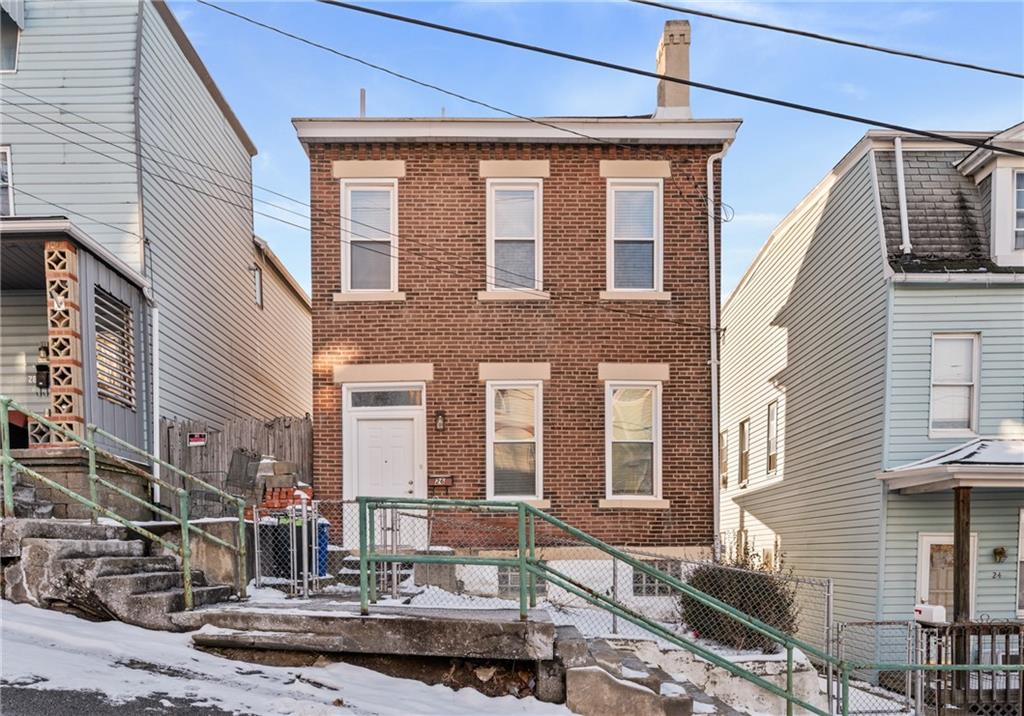 a front view of a house with street