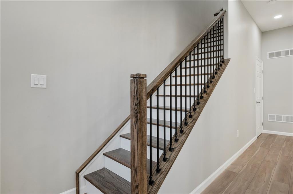 26 Yoder Street Pittsburgh, PA 15207 - Photo 14 of 30 a view of staircase with wooden floor and white walls