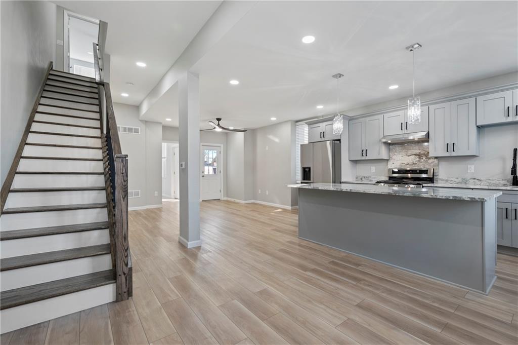 26 Yoder Street Pittsburgh, PA 15207 - Photo 2 of 30 a view of kitchen with wooden floor and electronic appliances