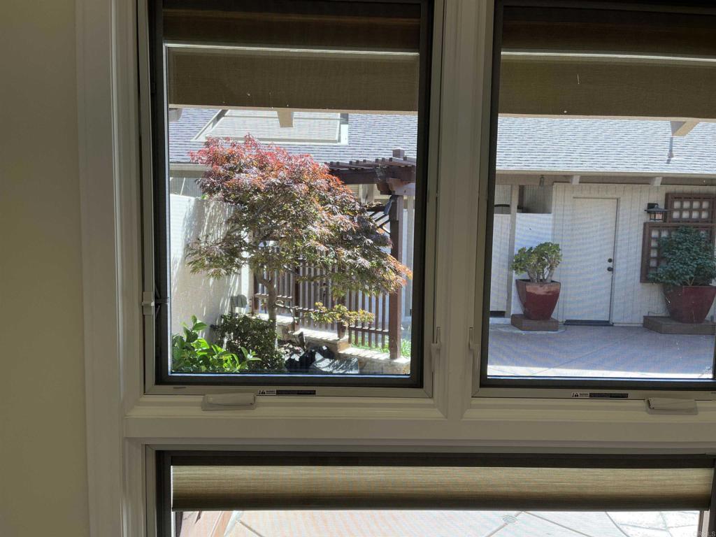 119 Cancha De Golf Rancho Santa Fe, CA 92091 - Photo 5 of 23 View from kitchen to front patio