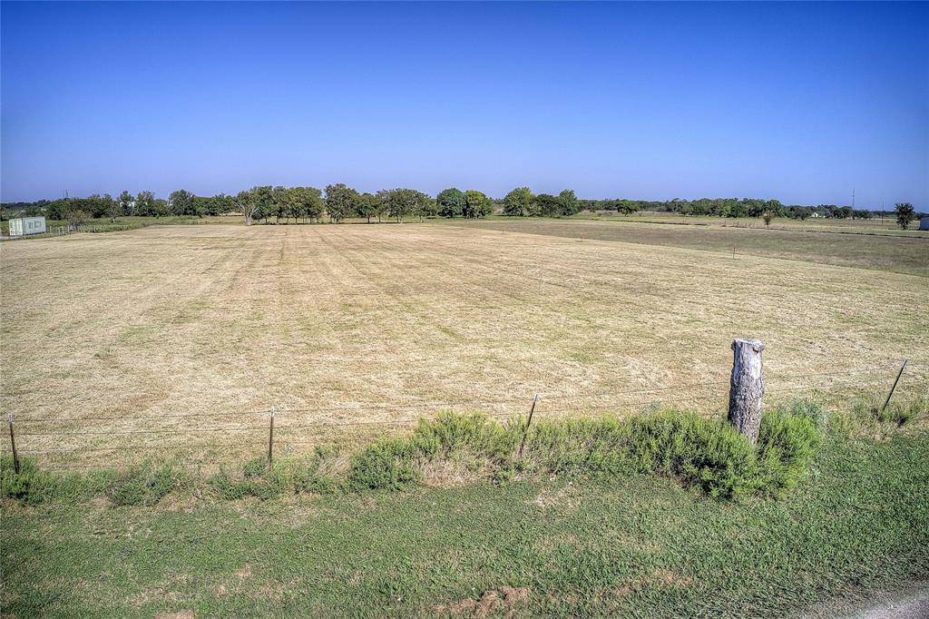 Lot 2 County Road 236 Terrell, TX 75160 - Photo 17 of 18 a view of a lake with a building in the background