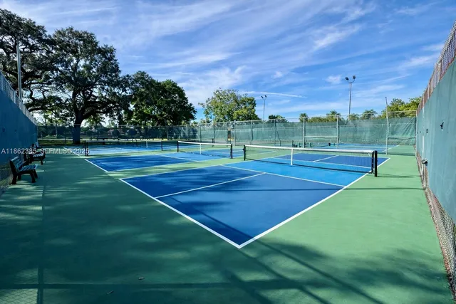 a view of an outdoor space and tennis court