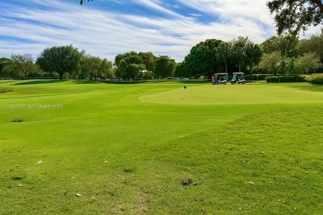 a view of a big yard with a fountain