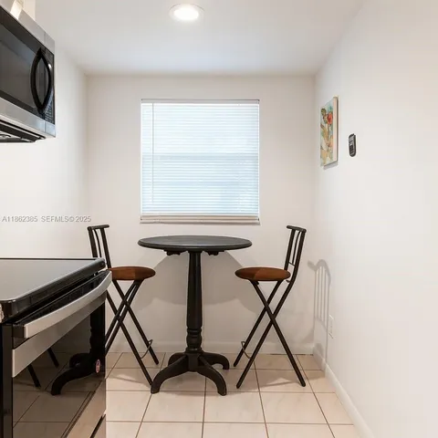 a view of a workspace with furniture