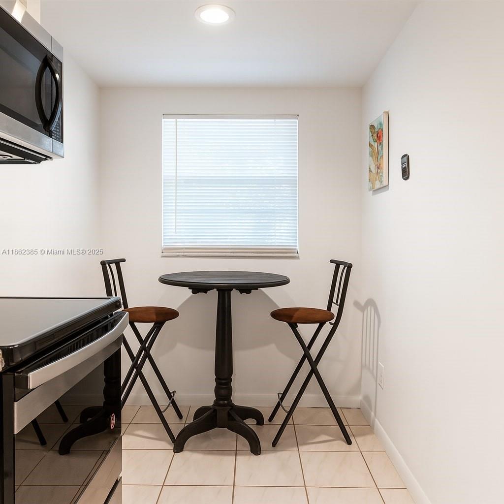 9330 Lagoon Place, Unit 206 Davie, FL 33324 - Photo 4 of 17 a view of a workspace with furniture