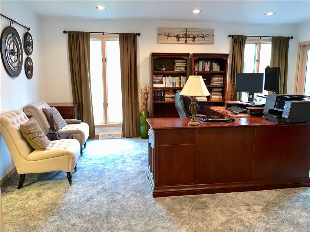 3450 Pinewood Road Irwin, PA 15642 - Photo 13 of 25 large main level den/office space w/double sided fireplace and sliders to deck