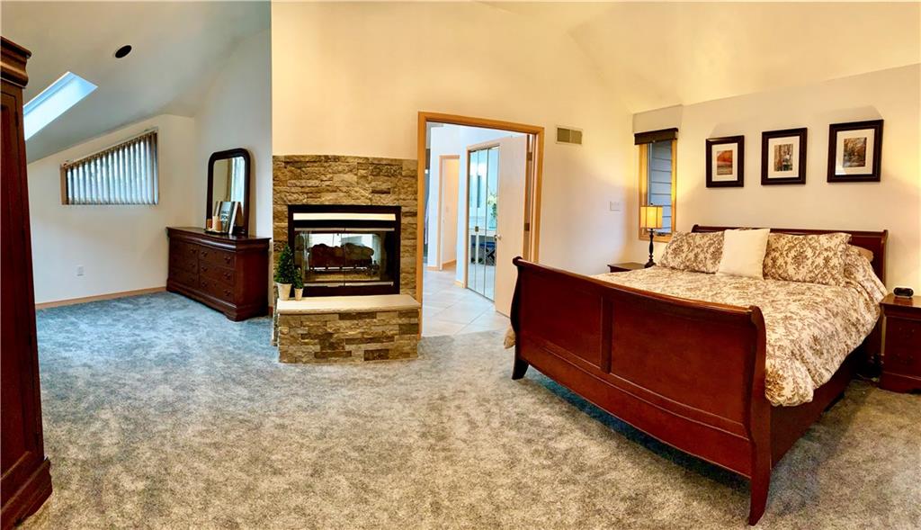 3450 Pinewood Road Irwin, PA 15642 - Photo 16 of 25 Upstairs master bedroom with sitting area and propane double sided fireplace to master bath. A retreat inside your retreat!