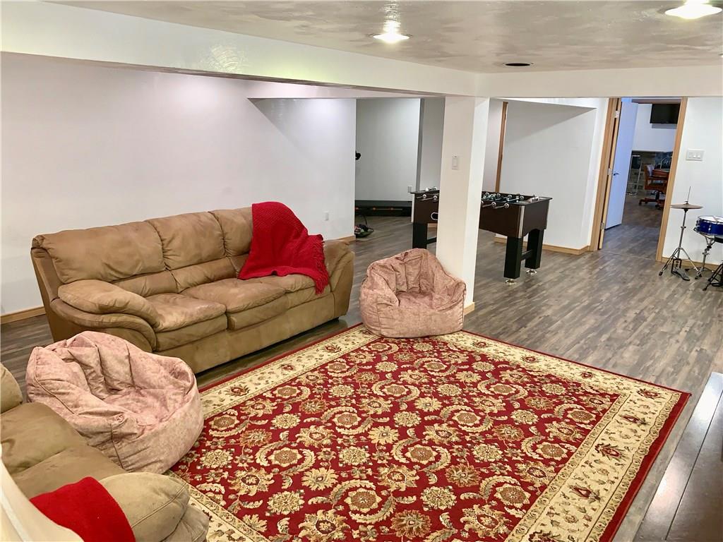 3450 Pinewood Road Irwin, PA 15642 - Photo 20 of 25 large lower level game room with luxury vinyl plank floor and two very large storage rooms!! Plus a wine cellar