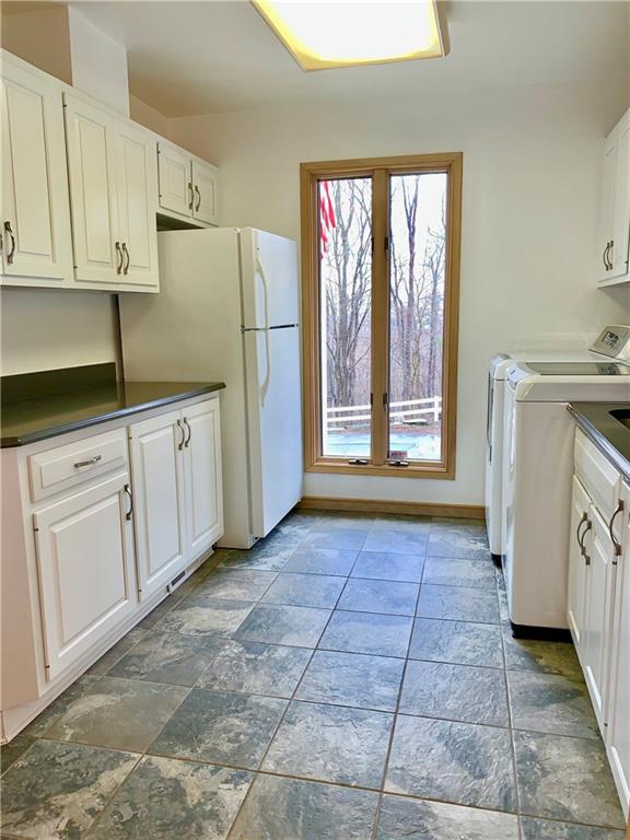3450 Pinewood Road Irwin, PA 15642 - Photo 6 of 25 laundry and additional cabinet/ refrigerator space off of kitchen~ very handy!!