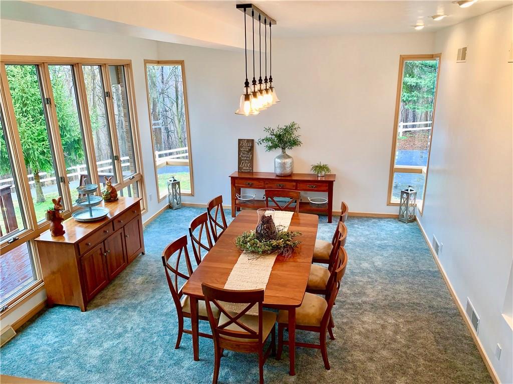3450 Pinewood Road Irwin, PA 15642 - Photo 7 of 25 Wow~ gorgeous sunken dining room with loads of natural light and unique angles. Love that light fixture!