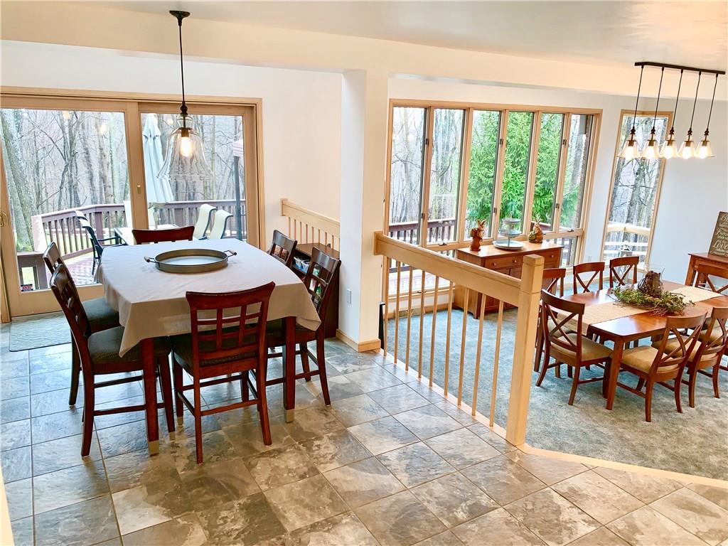 3450 Pinewood Road Irwin, PA 15642 - Photo 8 of 25 breakfast area off of kitchen with sliders to large deck and outdoor entertaining area. So much light!!