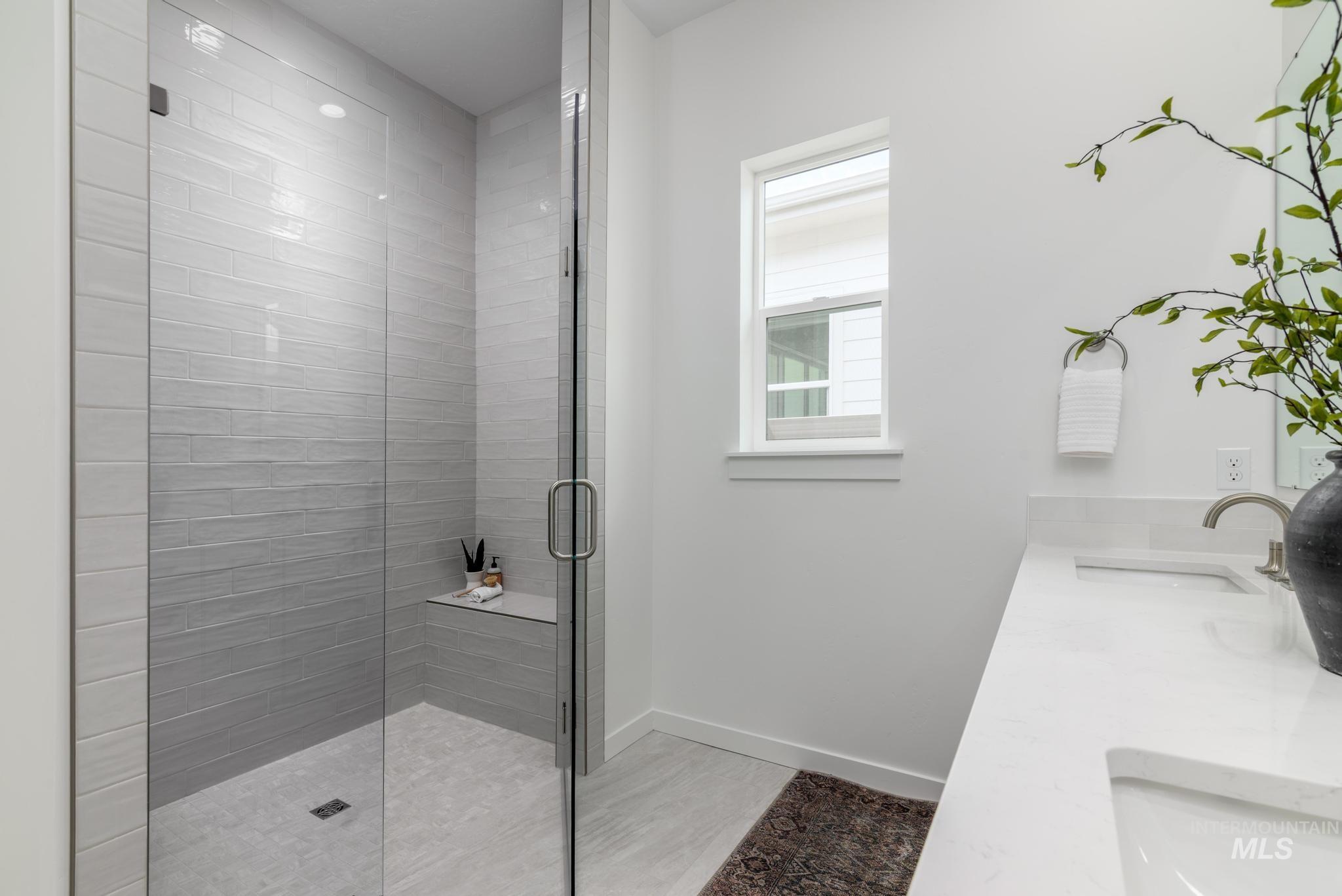 8554 West Fanning Street Star, ID 83669 - Photo 8 of 11 Bathroom with double vanity and a shower stall