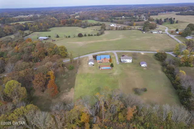 an aerial view of a house with a lake view