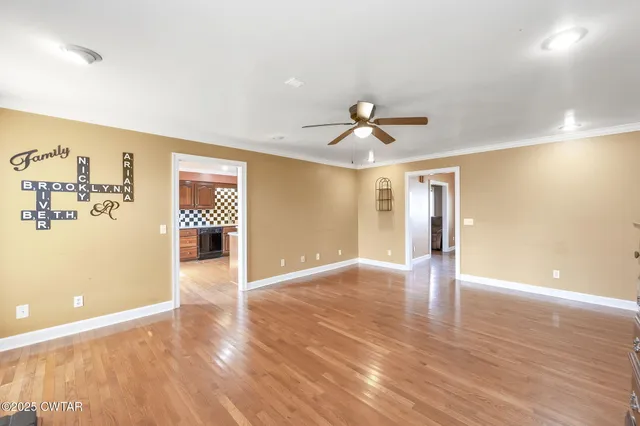 a view of a livingroom with wooden floor
