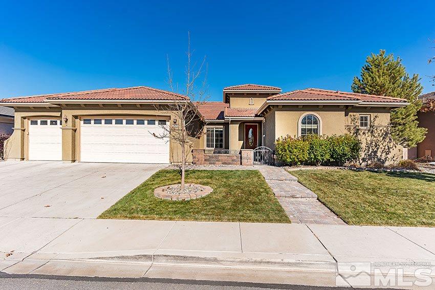 2635 Trail Rider Drive Reno, NV 89521 - Photo 1 of 25 a front view of a house with garden