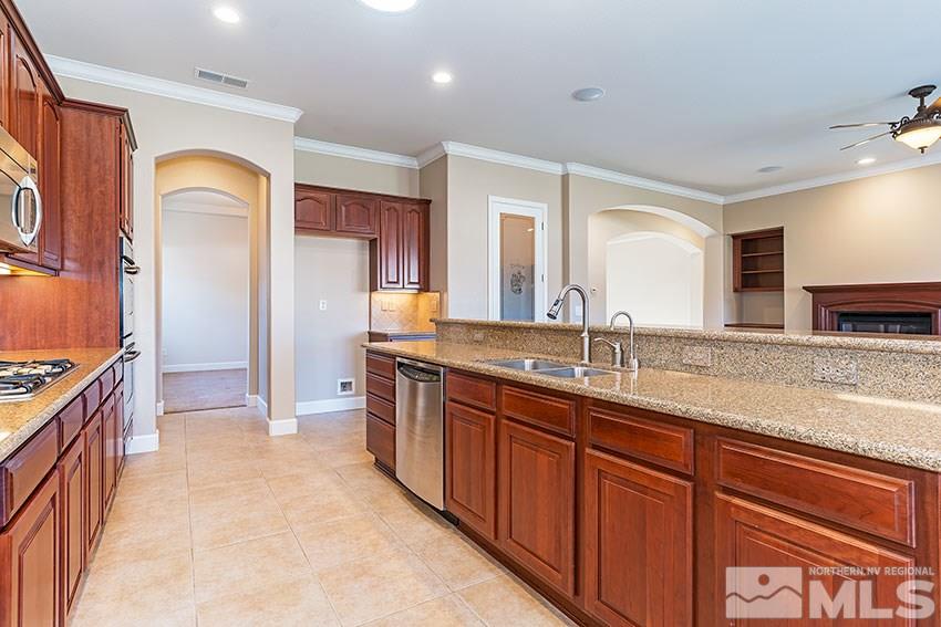 2635 Trail Rider Drive Reno, NV 89521 - Photo 13 of 25 a spacious bathroom with a granite countertop sink a mirror and a shower