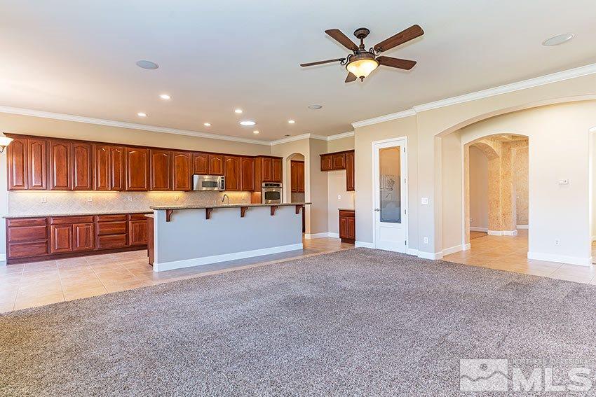 2635 Trail Rider Drive Reno, NV 89521 - Photo 10 of 25 a view of kitchen with furniture and a ceiling fan