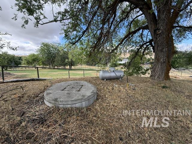 555 Cemetery Road Cambridge, ID 83610 - Photo 24 of 41 Expansive lot featuring mature trees, a fenced perimeter, and open grassy areas