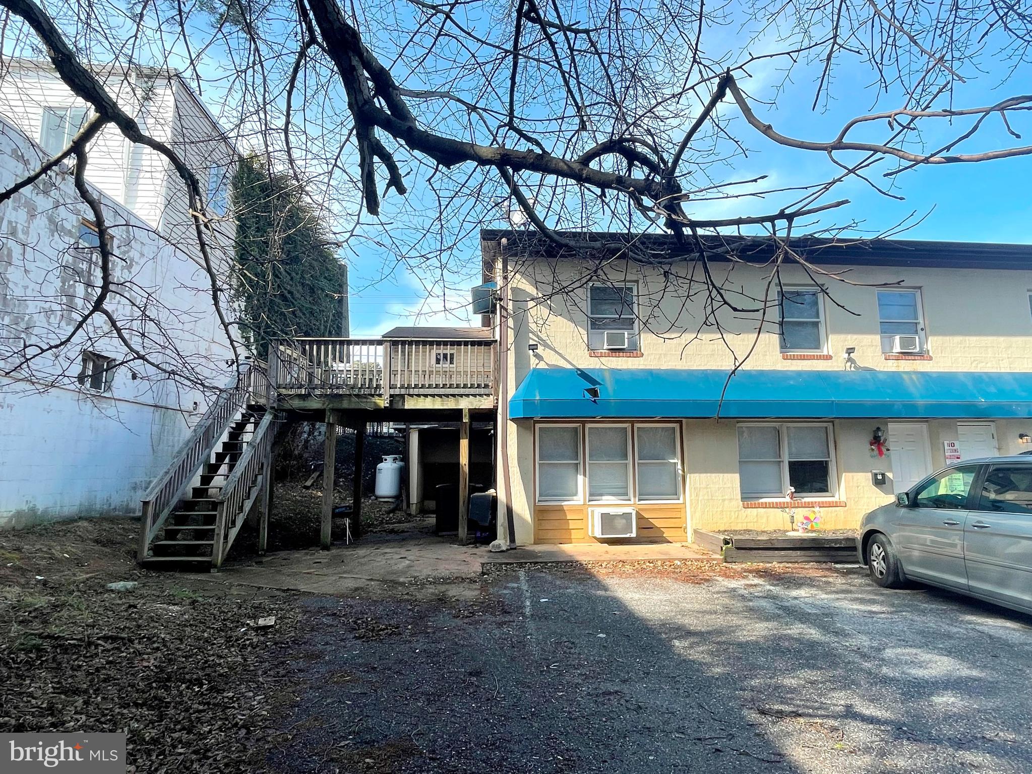 a view of a car park in front of house