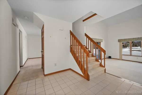 a view of front door with wooden floor