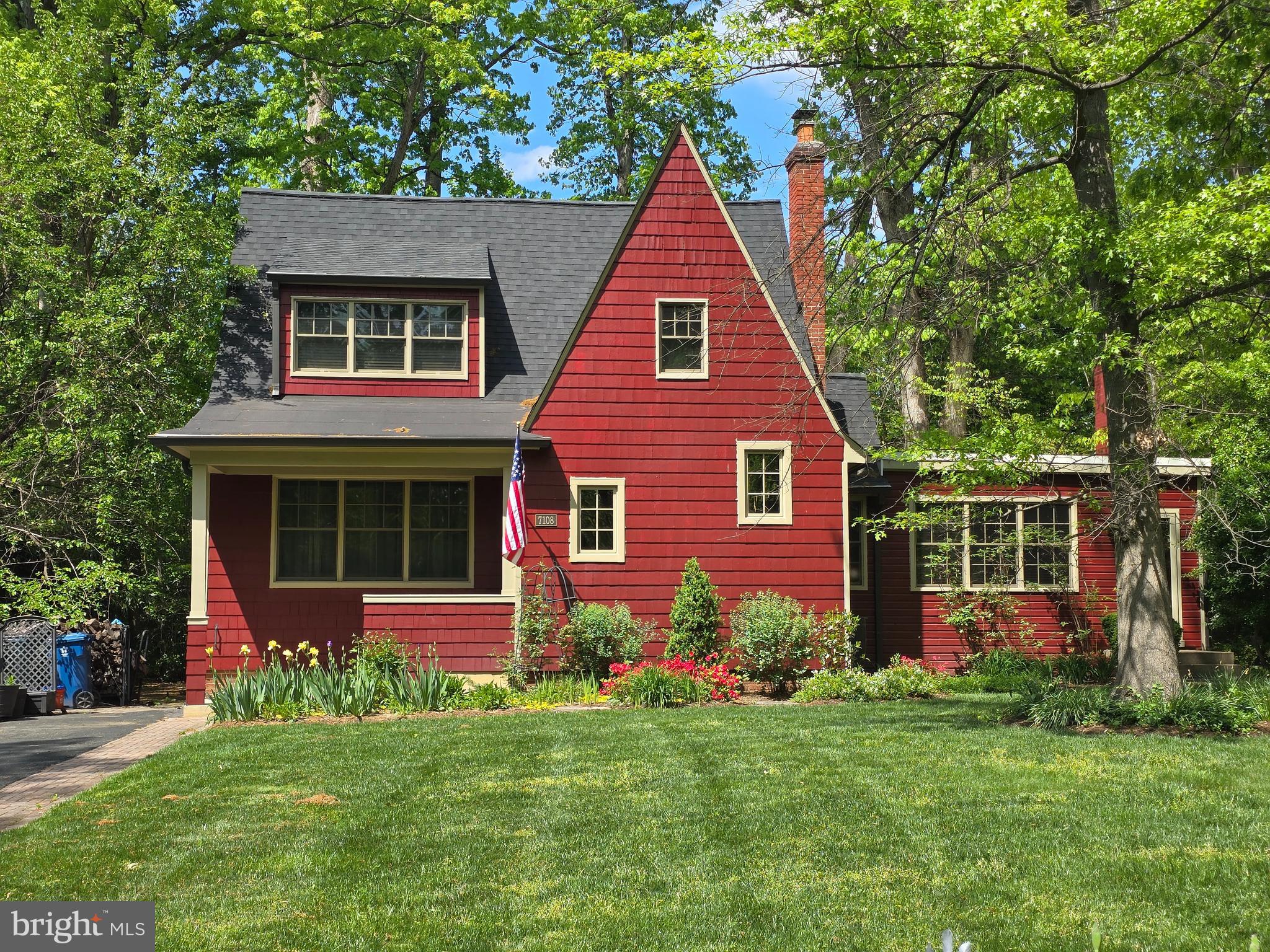7108 Larrlyn Drive Springfield, VA 22151 - Photo 1 of 50 a front view of a house with a garden