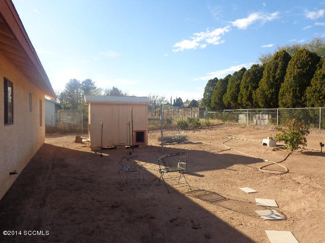 418 Curry Street Rio Rico, AZ 85648 - Photo 9 of 11 a view of a backyard of the house