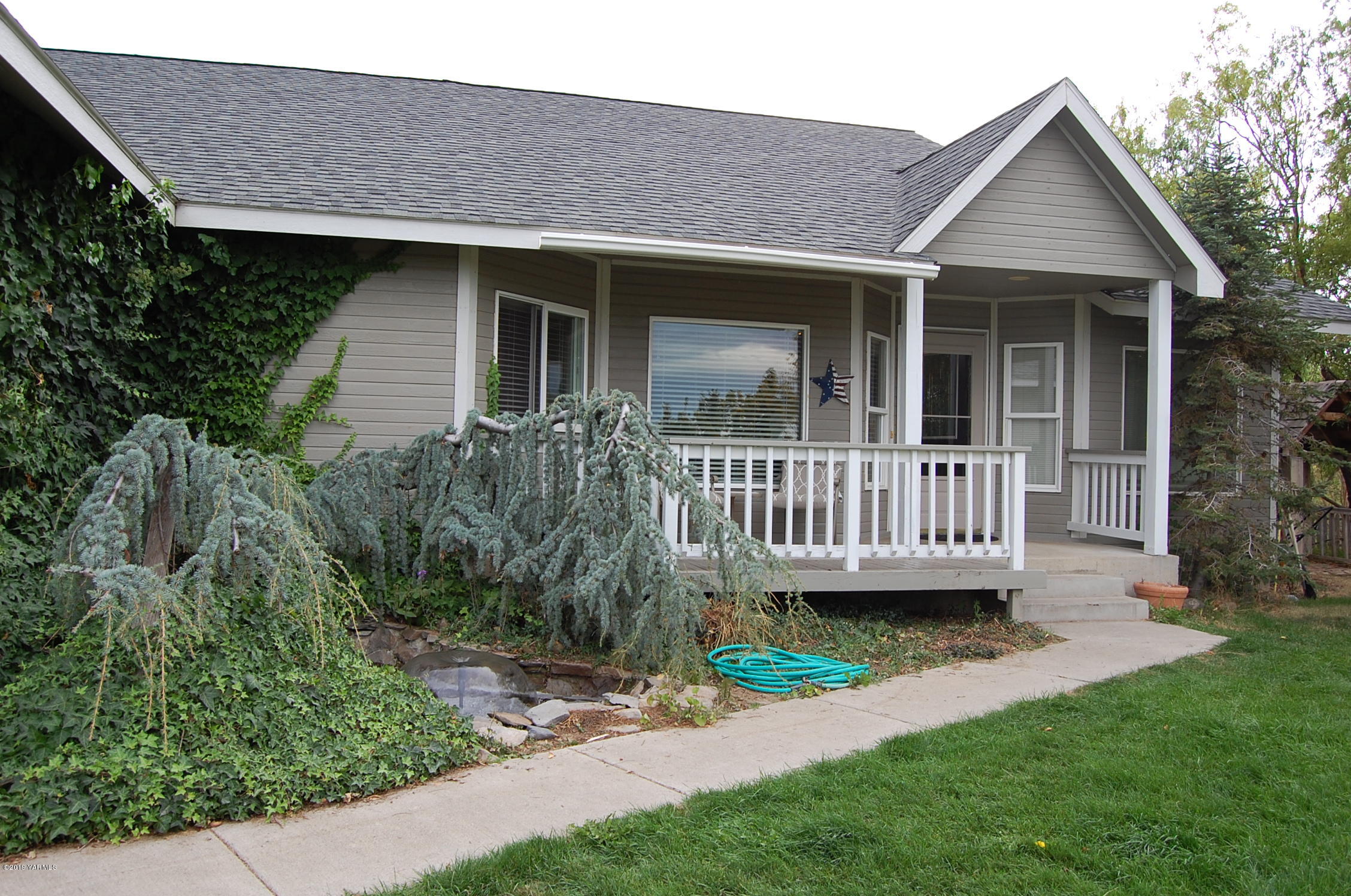 15021 Douglas Road Yakima, WA 98908 - Photo 2 of 35 a view of a house with a yard and deck