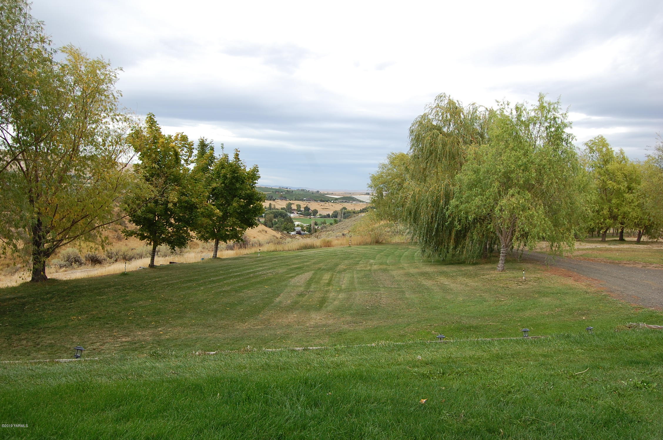 15021 Douglas Road Yakima, WA 98908 - Photo 28 of 35 a view of field with trees in the background