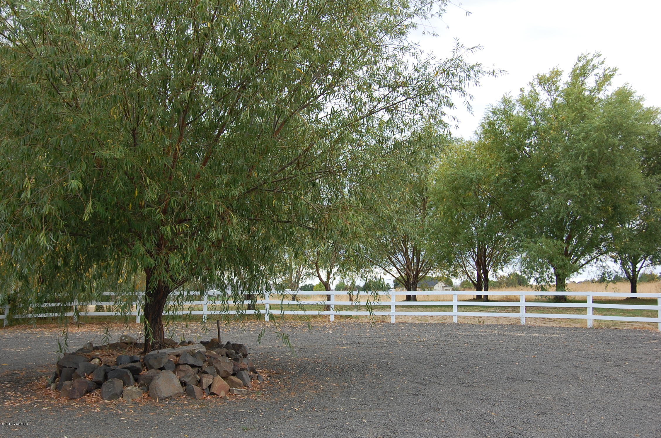 15021 Douglas Road Yakima, WA 98908 - Photo 29 of 35 a view of a street with a yard and large trees